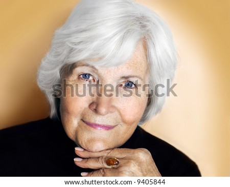 Senior lady portrait on pastel yellow background