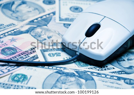 computer mouse on dollars banknotes background. E-commerce concept image.
