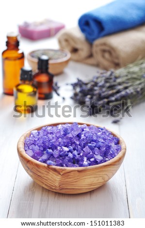 Sea salt in wooden bowl and lavender. Spa concept