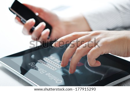 Female hands work with online banking on touch screen device