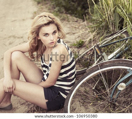 stock-photo-beautiful-girl-in-the-summer-around-bike-106950380.jpg