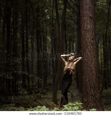 Romantic girl posing in the forest