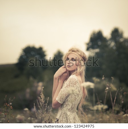 beautiful blonde in a summer field