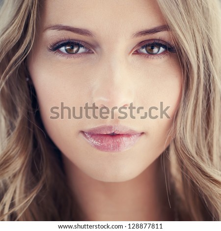 magnificent portrait of a beautiful young woman with perfect skin closeup
