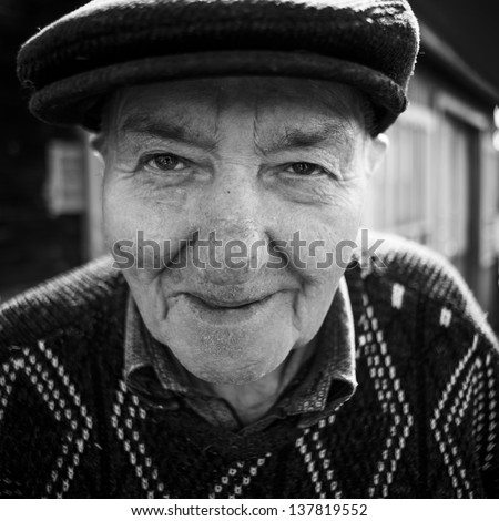 close-up portrait of an old man. black and white photo