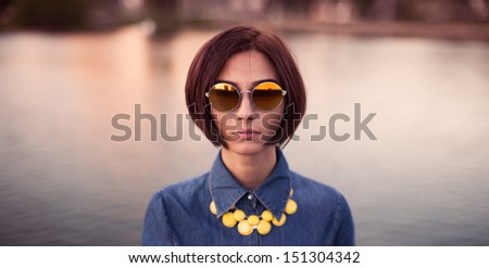 beautiful girl with a short hairstyle hipster glasses