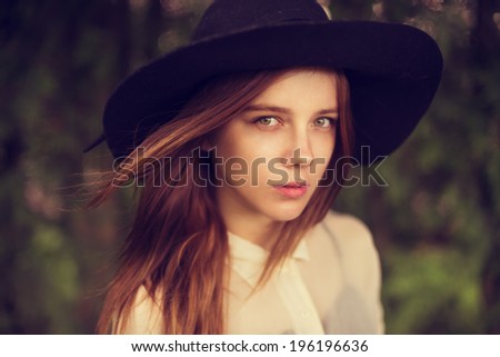 portrait of a beautiful girl in a hat