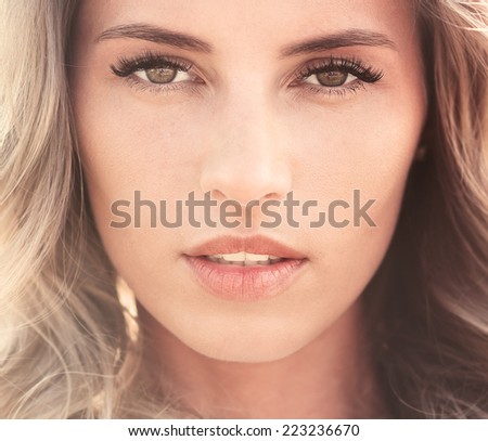 portrait of a beautiful sexy young woman with perfect skin and make-up closeup
