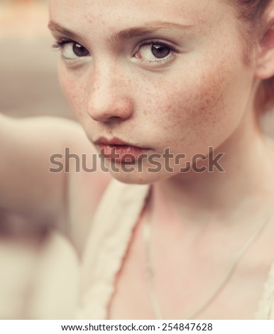 portrait of beautiful girl with freckles