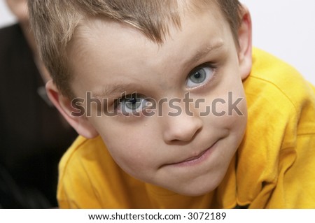 portrait of cute cheeky boy making faces