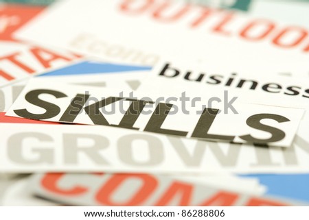 The word skills cut out from paper to signify business and personal growth in prosperous economic times