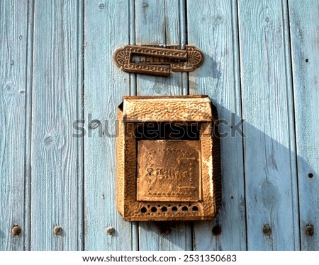 Similar – Image, Stock Photo old, pasted mailbox slot with a flap that says “LETTERS”, made of metal in an old wooden door, where the brown paint is peeling off / write letter / e-mail / mailbox company