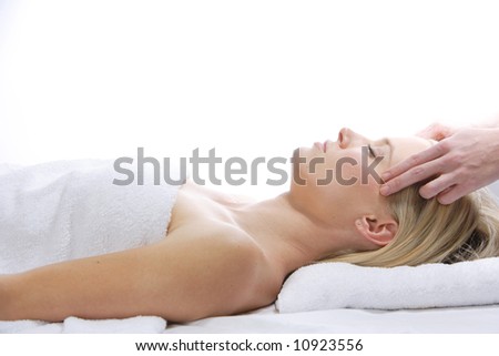 A woman gets a massage at a day spa