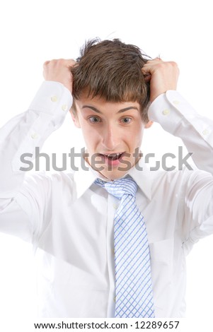 A stressed out business man pulling his hair out in the studio
