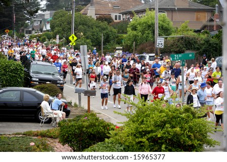 SANTA CRUZ, CA - JULY 26: Runners in the annual Wharf to wharf race from the Board Walk to Capitola.