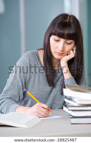 Young woman studying in a modern classroom
