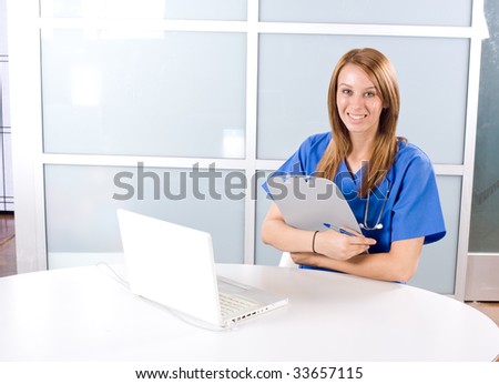 Female nurse at a desk working in a modern office