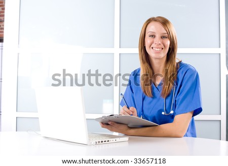 Female Nurse in a modern office holding a chart