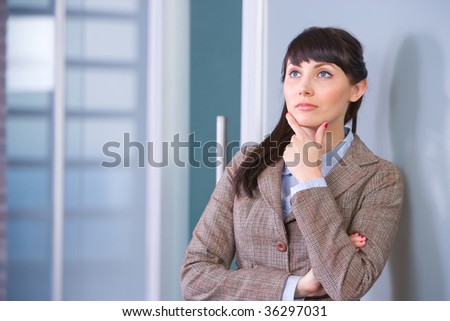 Business Woman Thinking in a Modern Office