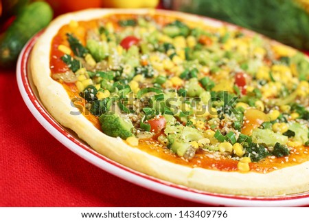 Pizza with cucumber, corn, pepper and cheese and ingredients