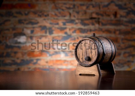 Old wooden barrel on a wood table