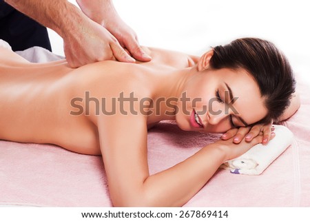 Spa beauty skin treatment woman on white towel. Caucasian female model with perfect skin lying on towel. Young woman isolated on white background.