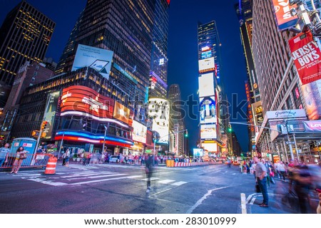 NEW YORK CITY, NY - JUN 24: Times Square and Broadway Theaters at night is one of  the most tourist visited location in New York City on June 24, 2014