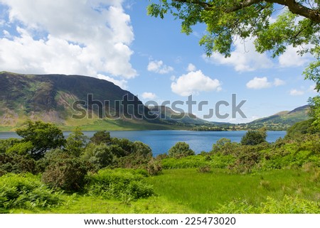 Crummock Water Lake District North West England UK between Buttermere and Loweswater on summer day with blue sky and white clouds