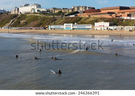 BOURNEMOUTH, DORSET, ENGLAND-JANUARY 16  2015: Sunny weather  brought visitors and surfers to Bournemouth on the Dorset coast to enjoy the winter sunshine on Friday 16th January 2015