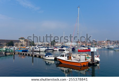 North Quay marina Weymouth Dorset UK with boats and yachts on a calm peaceful summer day with blue sky