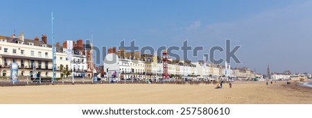 WEYMOUTH, DORSET, ENGLAND-SEPTEMBER 3  2014: Sunshine and warm weather brought visitors to Weymouth beach on the Dorset coast to enjoy this popular seaside town on Wednesday 3rd September 2014