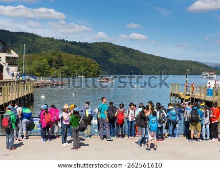 BOWNESS ON WINDERMERE, LAKE DISTRICT, ENGLAND-JULY 10 2014: Summer sunshine brought tourists and students to Bowness-on-Windermere a popular Lake District destination on Thursday 10th July 2014