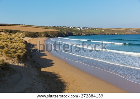 Crantock beach view to West Pentire North Cornwall England UK near Newquay in spring with blue sky and sea