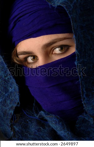 a model hides her face and shows her eyes