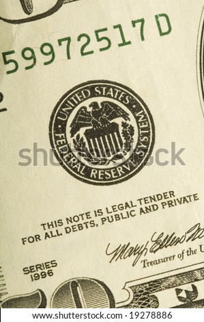 a fifty dollar bill showing the federal reserve icon