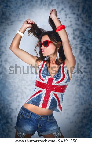 Girl wearing blouse with Britiain flag colors, heart shape glasses and dancing/Dance with Britain