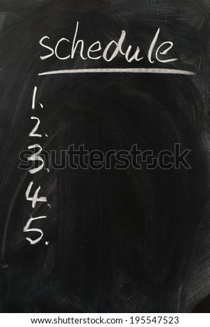 a vacant calendar written with chalk on a blackboard
