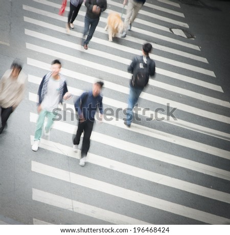 Busy city street people on zebra crossing