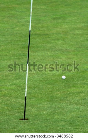 golf course, green grass, white ball, striped rod