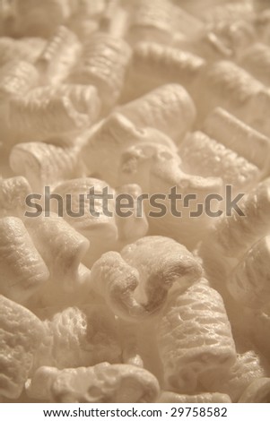 several brown styrofoam packing peanuts close up shot