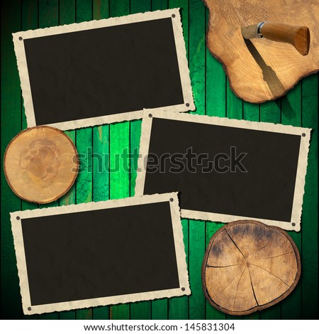 Vintage Photo Frames on Wood Green Wall / Three aged photo frames on wooden green background with sections of the trunk and folding knife