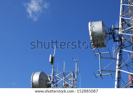 Telecommunication Towers on Blue Sky / Two communication towers with a beautiful blue sky