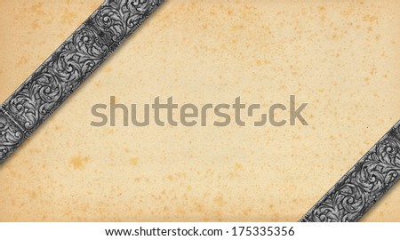 Old Paper and Silver Vintage Background / Yellowed old vintage abstract background with diagonal silver bands