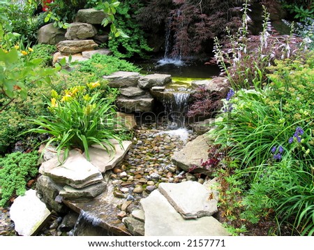 Close-up of a small stepped waterfall and pool in a landscaped oriental garden