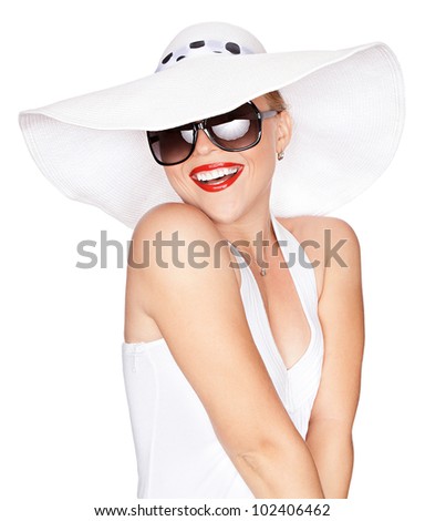 portrait of young beautiful woman in hat and sunglasses