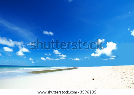 view of nice crystal clear ocean water covering the smooth sand