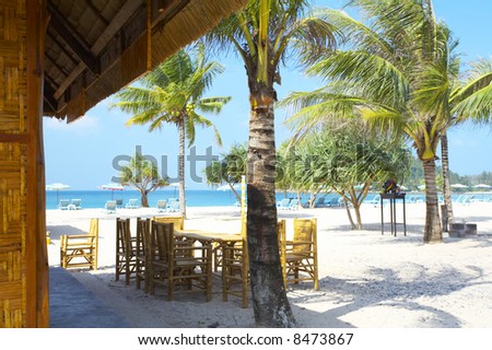 view of  nice exotic bamboo furniture in café on tropical beach