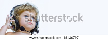 Portrait of young baby  listening music via phones.  Banner, lots of copy space