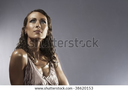 Stylish  high-contrast portrait of nice woman  on gray back
