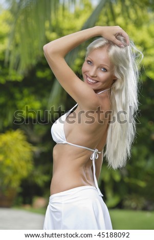 Portrait of young attractive woman having good time in tropic environment